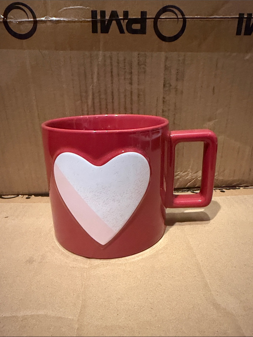Starbucks red mug with white and pink heart